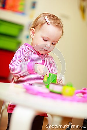 Little girl playing with toys Stock Photo