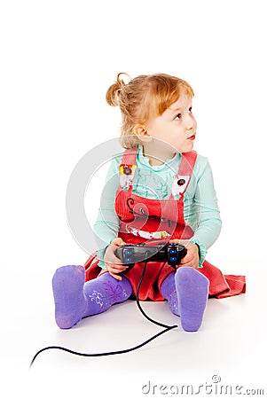 Little girl playing video games on the joystick Stock Photo