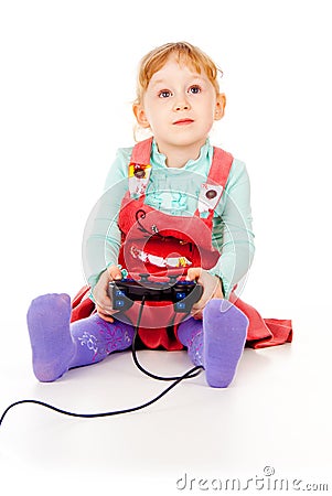 Little girl playing video games on the joystick Stock Photo