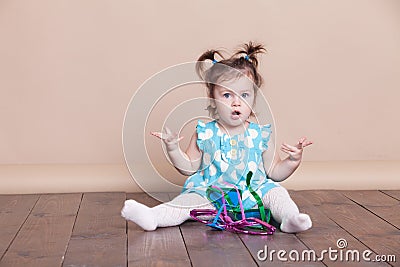 Little girl plays with big glasses, she funny Stock Photo