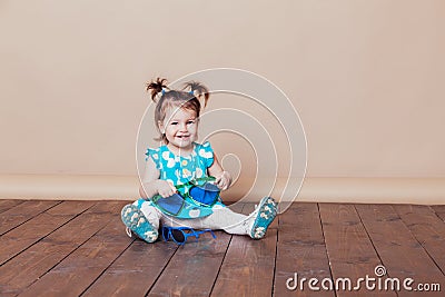 Little girl plays with big glasses, she funny Stock Photo