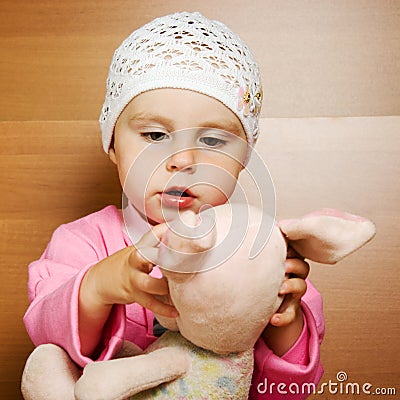 Little Girl With Plush Toy. Royalty-Free Stock Photo | CartoonDealer