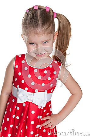 Little girl in a polka dot red dress Stock Photo