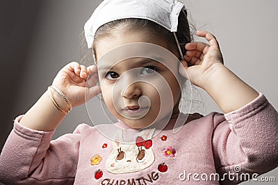 Little girl portrait with medical mask on her head Stock Photo