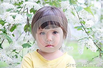 Little girl portrait in spring 4 years old, kindly smiling child toddler Stock Photo