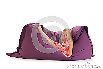 Little girl posing on beanbag Stock Photo