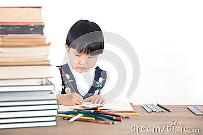 Little girl practicing writing in class Stock Photo