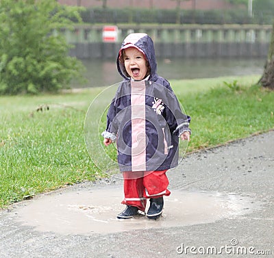 Little girl in a puddle Stock Photo