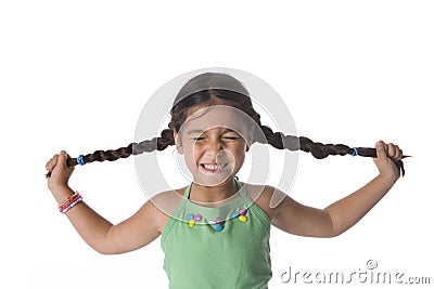 Little Girl Is Pulling Her Pigtails Stock Photo