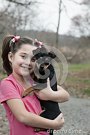 Little girl with puppy Stock Photo