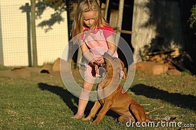 Little girl with puppy Stock Photo