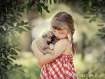 Little girl with a puppy Stock Photo