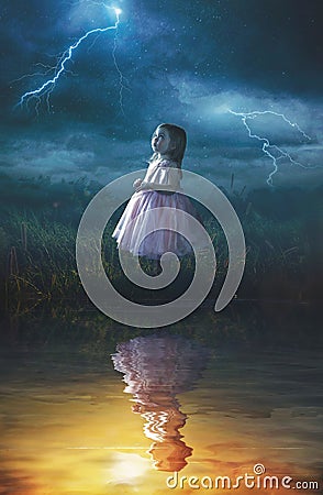 Little girl in rain storm Stock Photo