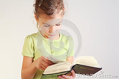 Little girl read bible Stock Photo