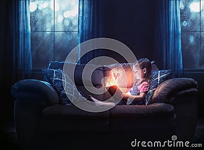 Little girl reads Stock Photo