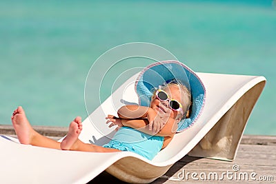 Little girl relaxing in tropic ocean background Stock Photo