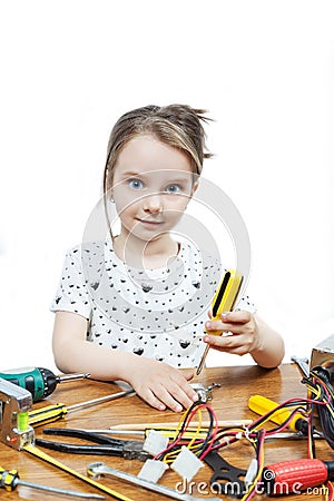 Little girl repair a computer component Stock Photo