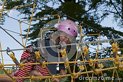 Little girl in rope park Stock Photo