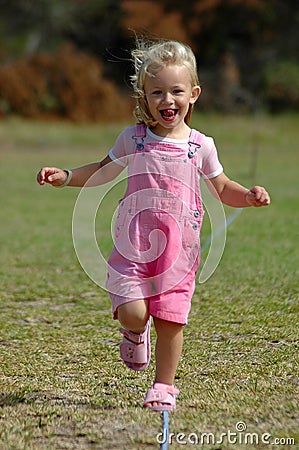 Little girl running Stock Photo