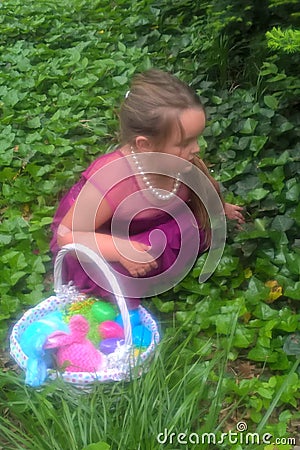 Little Girl`s Easter Egg Hunt Stock Photo