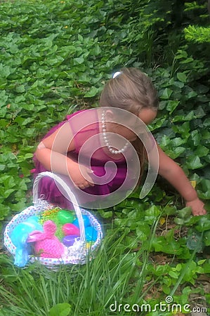 Little Girl`s Easter Egg Hunt Stock Photo