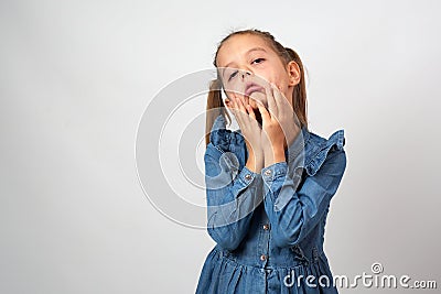 Little girl sad tired, sick exhausted, put hand on forehead Stock Photo