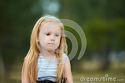 Sadness. Thoughtfulness. Little girl. Portrait child. Blonde Stock Photo