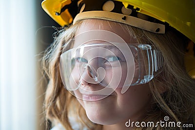 Little girl with safety helmet and goggles Stock Photo