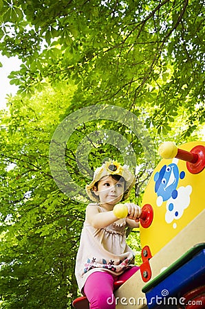 Little girl on seesaw/teeter-totter Stock Photo