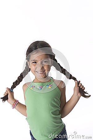 Little girl is showing her pigtails Stock Photo