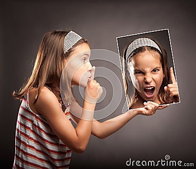 Little girl showing silence gesture Stock Photo