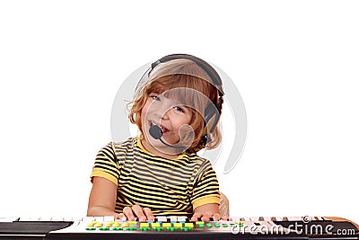 Little girl sing and play keyboard Stock Photo