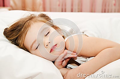 Little girl sleep in the bed Stock Photo