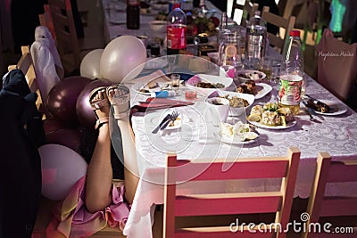 Polish wedding and a sleeping little girl at the table Editorial Stock Photo