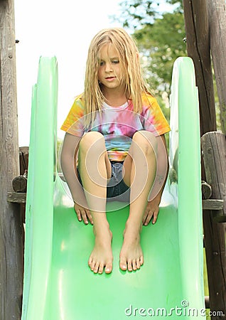 Little girl on a slide Stock Photo