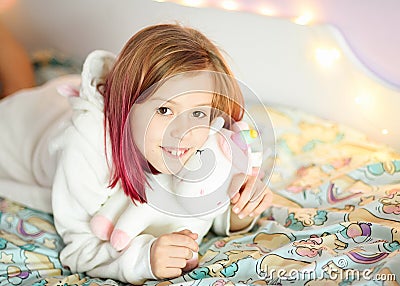Little girl is smiling. beautiful kids room. Stock Photo