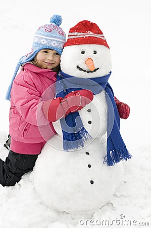 Little girl and snowman Stock Photo