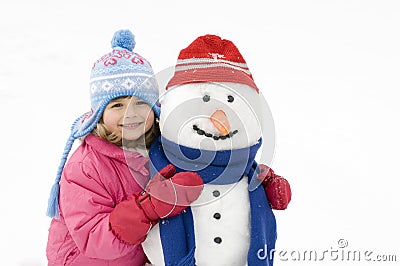 Little girl and snowman Stock Photo