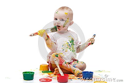 Little girl soiled by multi-colored paints Stock Photo