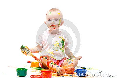 Little girl soiled by multi-colored paints Stock Photo