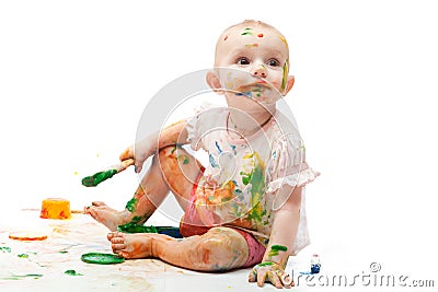 Little girl soiled by multi-colored paints Stock Photo