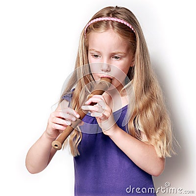 Little girl with soprano recorder Stock Photo