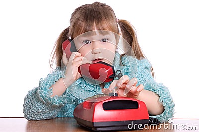 The little girl speaks by phone Stock Photo