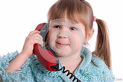 The little girl speaks by phone Stock Photo