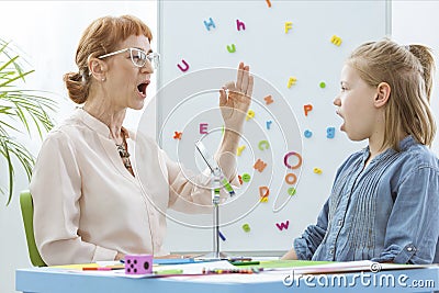 Little girl during speech therapy Stock Photo