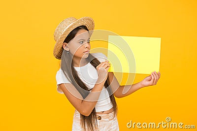 Little girl straw hat showing blank paper copy space, be aware of concept Stock Photo