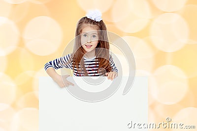 Little girl in a striped dress. Stock Photo