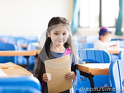 little girl student in the classroom Stock Photo