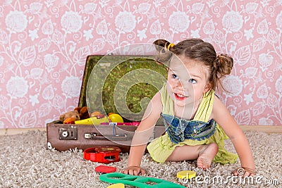 Little girl with suitcase Stock Photo