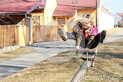 Little girl on a swing Stock Photo